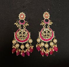 HOT PINK CHANDBALI EARRINGS - WOMEN'S TRADITIONAL MEENAKARI JEWELRY Elegant set of earrings with beautiful Meenakari work. A versatile pair of earrings with pink & Gold Meenakari, Kundan and Pearl drop. The engraved traditional design adds an artisanal touch to the earrings. Details: Handcrafted Jewelry Metal: Metal Alloy, Gold Plated Stone:  Meenakari, Pearls &  Pink Gems Style: Contemporary yet Traditional Closure:  Push back clasp B Anu Designs jewelry pieces can be customized in accordance w Cheap Meenakari Chandbali Jewelry, Luxury Meenakari Chandbali Earrings, Luxury Chandbali Danglers With Meenakari, Traditional Teardrop Pearl Drop Danglers, Fusion Style Pink Dangle Jewelry, Pink Pearl Drop Round Earrings, Pink Fusion Style Dangle Jewelry, Pink Teardrop Pearl Earrings, Pink Fusion Dangle Jewelry