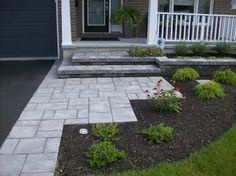 a front yard with steps and landscaping