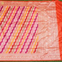 Banarasi rangkat dupattas merge the luxurious Banarasi silk with intricate rangkat weaving, originating from Varanasi. These dupattas boast elaborate motifs woven with colorful silk threads, showcasing traditional Indian patterns. Adorned with exquisite zari work, they epitomize elegance and are treasured for special occasions, symbolizing luxury and cultural heritage. Crafted by skilled artisans, Banarasi rangkat dupattas are timeless creations, reflecting the opulence of Indian textile traditi Handloom Weaving, Indian Patterns, Indian Textiles, Katan Silk, Zari Work, Silk Dupatta, Silk Thread, Weaving Techniques, Traditional Design