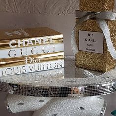 a stack of books sitting on top of a glass table