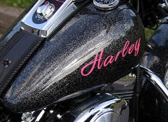 a close up of a motorcycle with the word harley on it