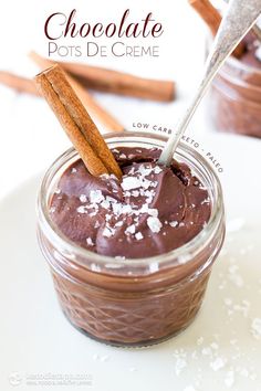 chocolate pots de creme in a jar with cinnamon sticks