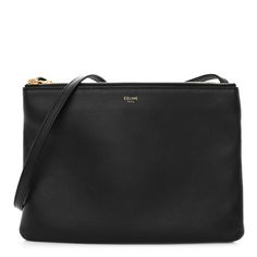 This is an authentic CELINE Lambskin Large Trio Crossbody Bag. This shoulder bag is crafted with supple black lambskin and features an adjustable crossbody strap, gold-tone hardware, and three compartments that unzip to a soft fabric interior. Celine Crossbody Bag, Celine Trio Bag, Celine Trio, Crossbody Bag Black, Black Cross Body Bag, Crossbody Strap, Large Bags, Soft Fabric, Soft Fabrics