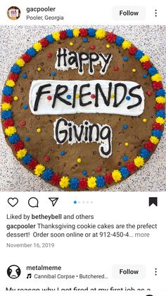 a cookie with the words happy friends giving written in white letters on it, surrounded by sprinkles and confetti