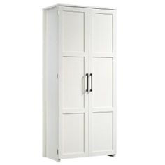 a tall white cabinet with two doors