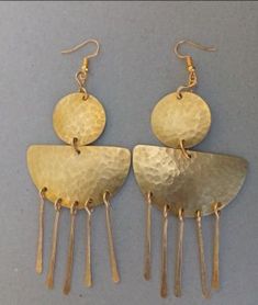 The earrings are  made with a lot of love and care from brass.  The are  beautifully designed for you, sister, mother, relative or a friend. The are light in weight and comfortable to wear. **This listing is for one pair of earrings.** Buy multiple items pay shipping for one the rest ships free. Custom orders are welcome. For more earrings, follow the link. https://www.etsy.com/listing/922901690/brass-wholesale-earrings-african?ref=shop_home_active_10 **Happy shopping** Dhl shipping express Thank you. Cheap Brass Jewelry With Matching Earrings, Luxury Brass Earrings For Ceremonial Occasions, Cheap Traditional Brass Jewelry, Unique Cheap Brass Earrings, Affordable Symbolic Brass Earrings, Cheap Unique Brass Earrings, Cheap Brass Jewelry For Festivals, Cheap Traditional Brass Earrings, Handmade Brass Dangle Chandelier Earrings