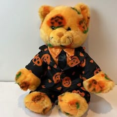 a teddy bear dressed up in halloween clothes