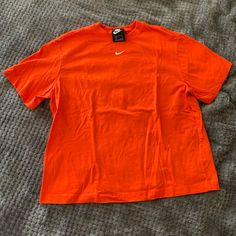 Size Small Brand New Without Tags Has Never Been Worn Excellent Condition Nike Orange Crew Neck T-shirt, Nike Casual Solid Color T-shirt, Nike Casual Solid T-shirt, Casual Solid Nike T-shirt, Casual Solid Color Nike T-shirt, Casual Nike T-shirt, Basic Orange Tops For Streetwear, Nike Orange Short Sleeve Tops, Nike Basic Summer Tops