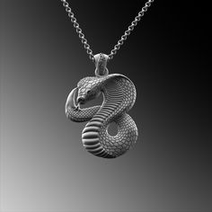 This expertly crafted Silver Cobra Serpent Pendant necklace casts a spell of captivation on all those who wear it! A bold piece for anyone who loves Mythical Jewelry . Buy for yourself or give it as a gift for that special someone in your life! ★Item Details ◆ Material : 925K Sterling Silver ◆ Pendant Height : 1.18 inch x 3 cm ◆ Bail Height : 0.39 inch x 1 cm ◆ Bail With : Suitable for up to  0.19 inch x 5.00 mm Chain ◆ Rolo Chain Thickness : 0.059 inch x 1.5 mm | Foxtail Chain Thickness : 0.078 inch x 2 mm ◆ Pendant Weight : 19 Grams ◆ Rolo Chain Weight : 18 Inches - (45cm) = 4.50 Gr 20 Inches - (50cm) = 5Gr 22 Inches - (55cm) = 5.50 Gr 24 Inches - (60cm) = 6.05 Gr 26 Inches - (65cm) = 6.60 Gr 28 Inches - (70cm) = 7.12 Gr ◆ Foxtail Large Chain Weight / 28 Inches - (70cm) : 15 gr ◆ Chain T Mythical Jewelry, Silver Snake Necklace, Snake Necklace Silver, Unique Gifts For Him, Snake Necklace, Rolo Chain, Gold Collection, Necklace Sterling Silver, Men Necklace