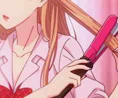 a girl holding a hair brush and combing her long blonde hair in front of a pink background