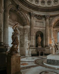 an ornate room with statues and sculptures in it