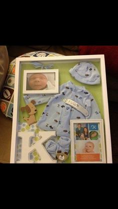 a baby's first year photo frame with its name and pictures on it, including a teddy bear