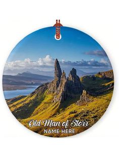 a round ornament with an image of the old man of storr