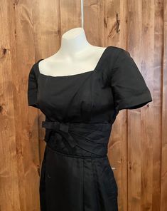 Gorgeous Abe Schrader cocktail dress from the 1950s. It's a classic hourglass shape with an adorable waist detail. So Audrey in Sabrina.  It's been dry cleaned and is excellent shape.   Measures:   Bust 41" Shoulders 15"  Waist 28"  Bodice length 16.5  Hips 40"  Total length 43.5" Classic Vintage Dress With Fitted Bodice For Formal Occasions, Classic Fitted Vintage Dress For Formal Occasions, Classic Vintage Evening Dress For Summer, 1950s Style Fitted Formal Dresses, Retro Vintage Dress With Fitted Bodice For Formal Occasions, Retro Formal Vintage Dress With Fitted Bodice, Fitted Dresses In 1950s Style For Formal Occasions, Formal A-line Vintage Dress With Fitted Bodice, Classic Vintage Dress With Fitted Bodice For Evening