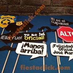 a table topped with cake toppers and signs