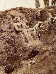 an old photo of some people working in the dirt with rocks and sand behind them