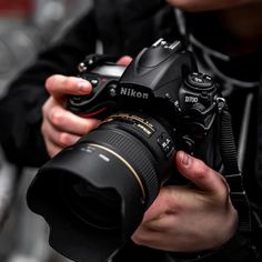 a person holding a camera in their hands