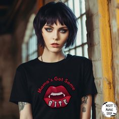 Unleash your inner goth and celebrate your love for the darkly whimsical with our Gothic Vamp Mama Tshirt - a timeless canvas for your alternative style and a commitment to sustainability. Crafted with meticulous attention to detail, this shirt is not just a fashion statement; it's a reflection of your unique expression.   Key Features:   🖤 Gothic Elegance: This ultra cotton tee boasts a classic fit and medium fabric weight (6.0 oz/yd²)--the perfect match for all-season wear. Made from 100% US Edgy Black T-shirt For Party, Black Emo T-shirt For Halloween, Fitted Punk Style Party T-shirt, Grunge Halloween Party Tops, Emo Halloween T-shirt With Short Sleeves, Emo Halloween Crew Neck T-shirt, Halloween Emo Crew Neck T-shirt, Emo Crew Neck T-shirt For Halloween, Emo Graphic Print T-shirt For Cosplay