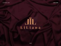 the logo for an italian clothing brand is shown in gold on a maroon satin background