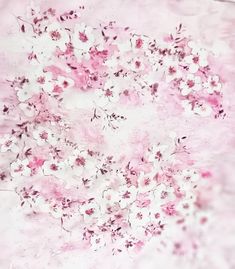 pink and white flowers are in the middle of a square piece of paper that has been painted with watercolors on it