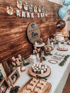 a table topped with lots of food and desserts