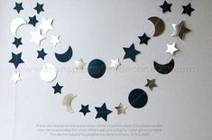 the moon and stars are hanging on the wall