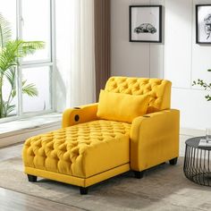 a yellow chair sitting in front of a window