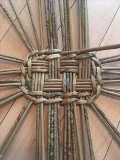 a bunch of sticks that are laying on the floor in some kind of basket weave