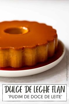 a cake that is sitting on a plate with the words dulce de leche flan written below it