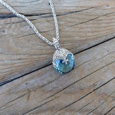 "Blue topaz necklace...1 1/4\" tall with bail by 3/4\" wide at the widest spot, cast in sterling silver 925 with a beautiful 18mm by 16mm checkerboard cut Sky blue topaz stone...the chain is 19\" with a lobster catch also in sterling silver 925...beautiful detailed necklace" Silver Blue Topaz Pendant Necklace, Silver Oval Pendant Jewelry With Blue Topaz, Silver Oval Blue Topaz Pendant Jewelry, Silver Blue Topaz Oval Pendant Jewelry, Handmade Silver Blue Topaz Necklace, Handmade Silver Aquamarine Necklace, Silver Blue Topaz Oval Pendant Necklace, Handmade Blue Topaz Pendant Jewelry, Turquoise Blue Topaz Pendant Jewelry