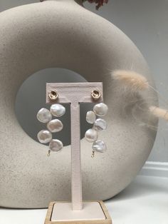 Introducing our iconic Petal-Shaped Baroque Pearl Dangle Earrings - the ultimate statement piece for any special occasion, such as wedding and Proms. Each earring showcases large, stunning petal-shaped Baroque pearls, which boasts a natural color and shine that is both unique and eye-catching.  These high-quality earrings are crafted with care. The elegance and sophistication of these earrings make them the perfect accessory for any special events. They are head-turning, statement earrings that White Teardrop Cluster Earrings For Party, White Drop Pearl Earrings For Party, White Cluster Earrings With Pearl Drop For Party, White Drop Linear Earrings For Wedding, White Single Chandelier Earring For Formal Occasions, White Pearl Bridal Earrings For Celebration, White Drop Bridal Earrings For Evening, White Pearl Drop Earrings For Celebration, White Pearl Drop Chandelier Earrings For Celebration