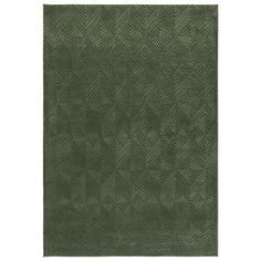 a green rug with an intricate design on the front and back side, in shades of gray