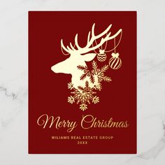 a red and gold christmas card with reindeer head