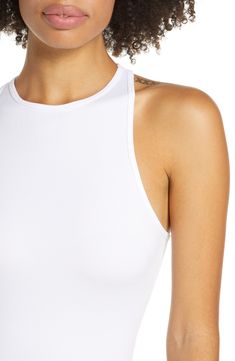 Lounge or layer in this oh-so-versatile ribbed crop top that looks (and feels) great wherever you go. 17" length (size Medium/Large) Crewneck Sleeveless Racerback 92% nylon, 8% spandex Machine wash, dry flat Imported Summer Ribbed Bodycon Tops, Ribbed Bodycon Summer Tops, Ribbed Bodycon Tops For Summer, Chic High Stretch Crop Top For Summer, Versatile Crop Top With Tank Straps For Spring, Fitted Tank Top Crop Top For A Day Out, Summer Ribbed Racerback Crop Top, Ribbed Racerback Crop Top For Summer, Fitted Halter Neck Crop Top Athleisure