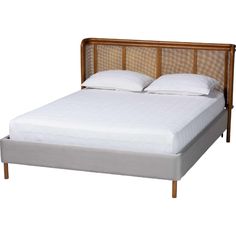 the headboard and foot board are made from wood, with white linens on it