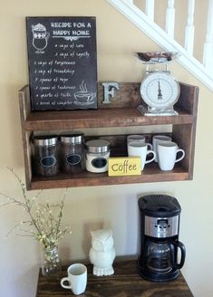 a shelf with coffee cups and a clock on it