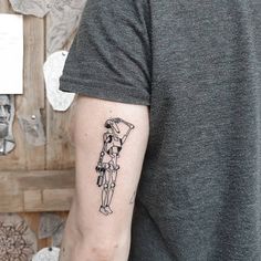 a person with a tattoo on their arm