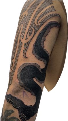 a man with a tattoo on his arm