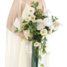 a bride holding a bouquet of white flowers