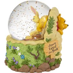 a snow globe with winnie the pooh and eef