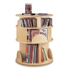 a wooden book shelf with books on it and a magazine rack in the middle that holds several books