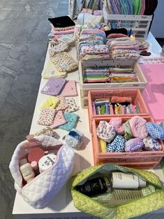 the table is covered with many different items for making quilts and other crafting projects