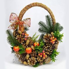 a basket filled with pine cones and berries