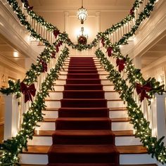 the stairs are decorated with christmas garland and lights