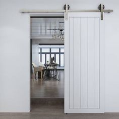 an open door leading to a dining room