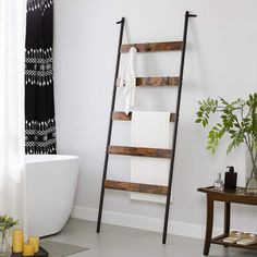 a bathroom with a ladder leaning against the wall