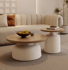 a living room filled with furniture and a bowl of fruit on top of a table