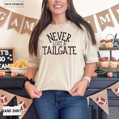 a woman wearing a t - shirt that says never lost tailgate