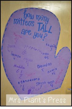 a purple paper mitt with writing on it