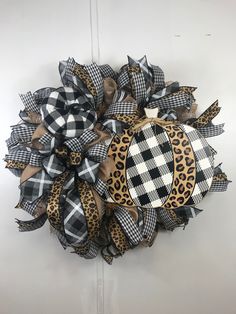 a black and white checkered wreath with leopard print